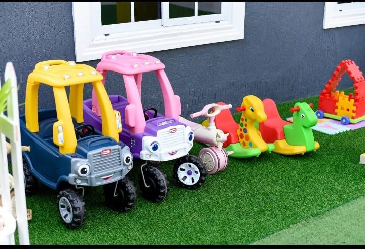 Outdoor play equipment arranged for young children at HoneyBerry