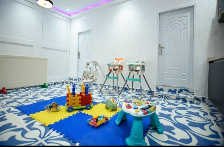 Bright early years playroom prepared for young children