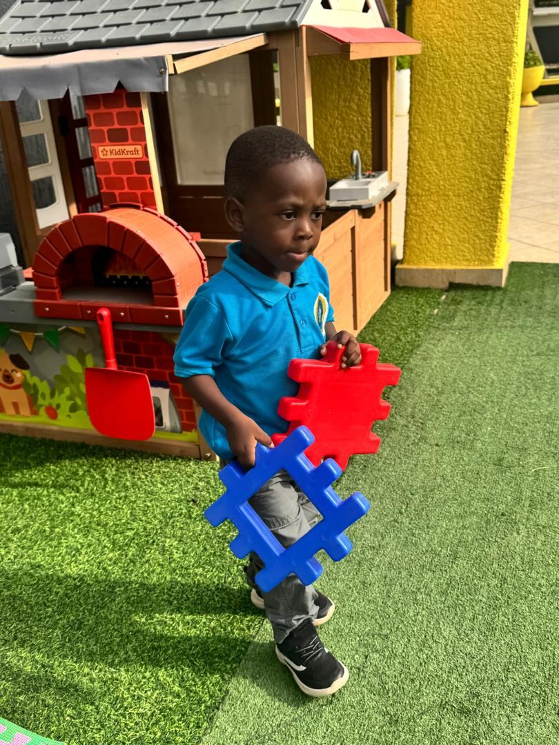 Young learner exploring an activity toy